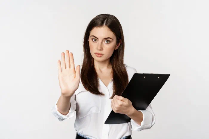 A business owner sorting through a pile of unfiled receipts and invoices