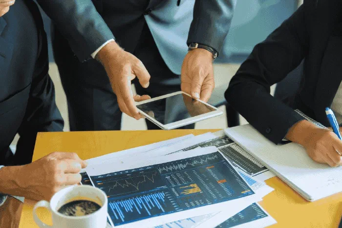 A business owner reviewing purchase invoices and asset records