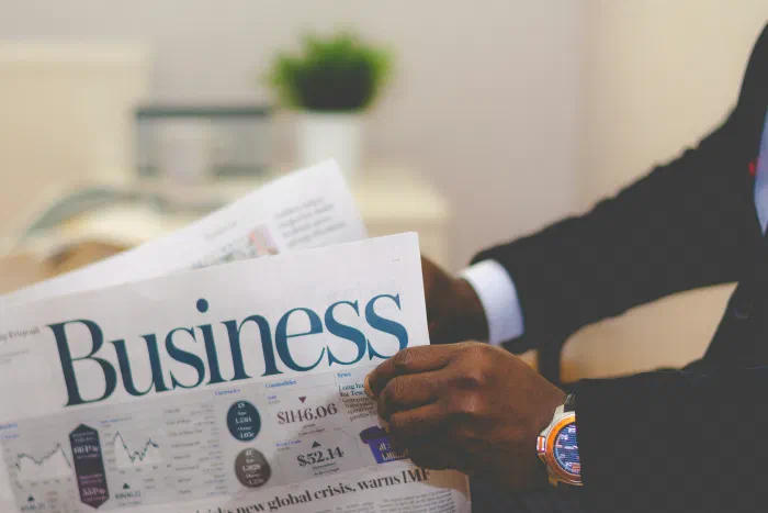 A notebook with a business setup checklist on a desk