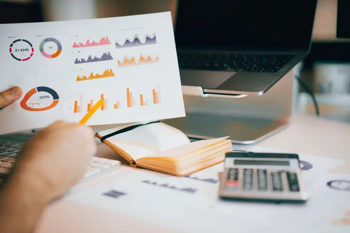 A founder writing out standard operating procedures for their business