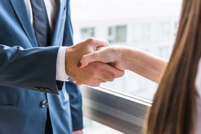 Two people reviewing paperwork to formally close down a business