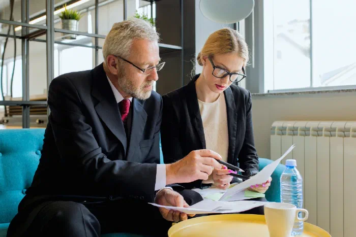A team discussing business compliance and financial reporting requirements