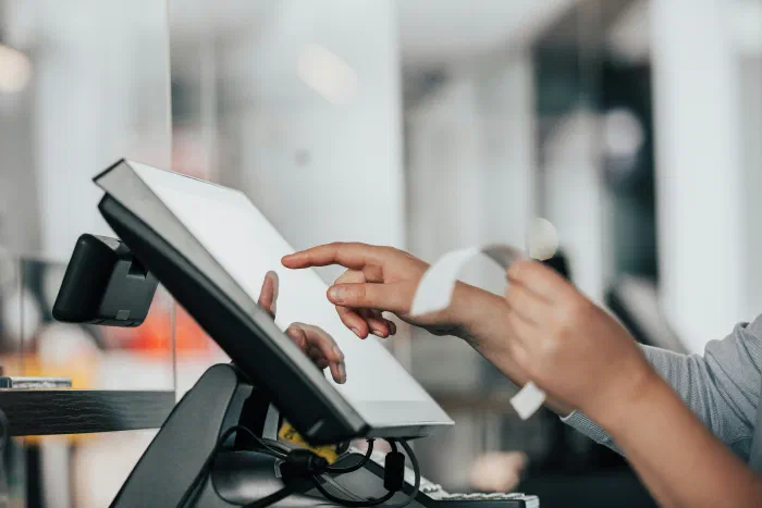 A business owner using a digital point-of-sale system