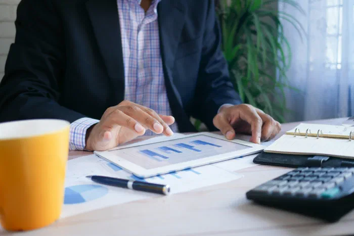 A business owner reviewing clear financial reports at their desk
