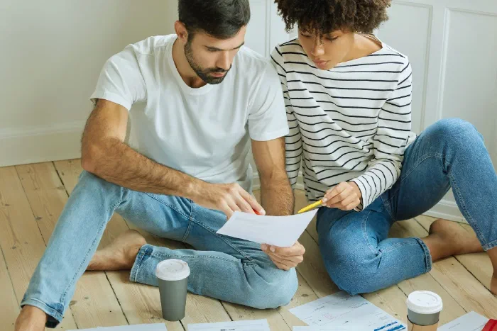 A self-employed individual organising paperwork to prepare their Form 11 self-assessment return