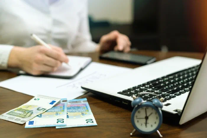A business owner reviewing supplier payment records for tax reporting