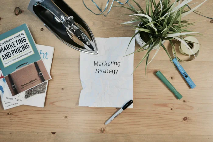 A business owner reviewing marketing spend alongside financial reports