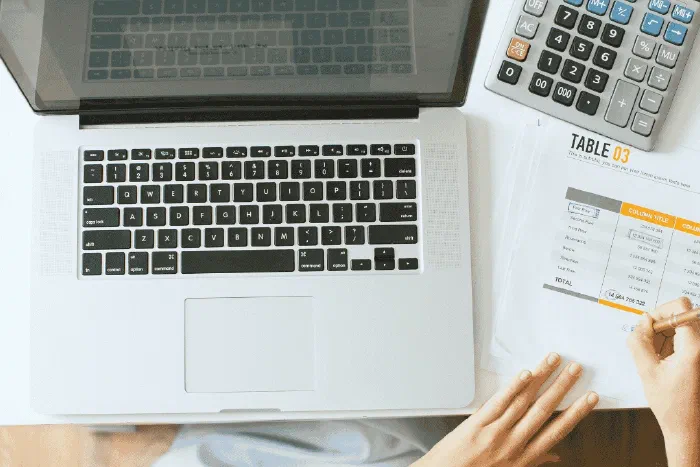 A payroll administrator reviewing employee pay and deduction records
