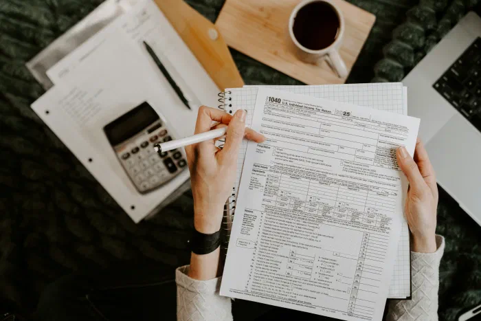 A small business owner reviewing financial reports and planning ahead