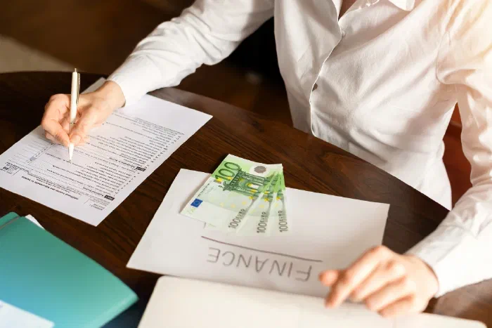 A person reviewing payslip deductions and social insurance contributions