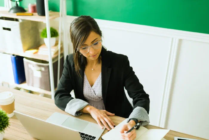 A small business accountant taking a proactive approach to accounting with a client A small business accountant taking a proactive approach to accounting with a client