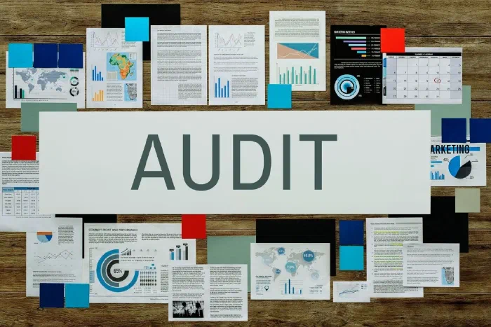 A business owner reviewing official correspondence and financial documents