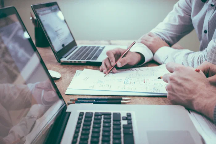 A business owner reviewing financial reports before a business sale