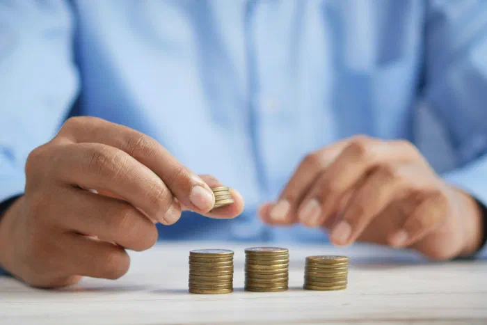 Coins sorted into separate stacks on a desk