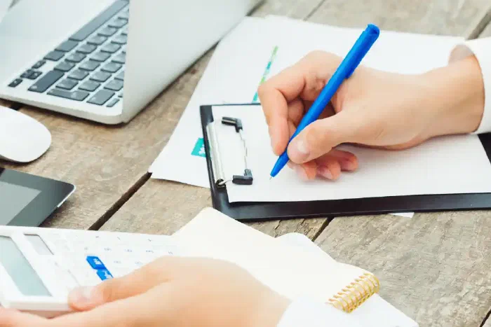 A business owner completing VAT registration paperwork for their Irish company