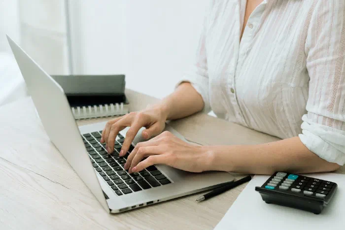 An accountant working through VAT registration paperwork for a client