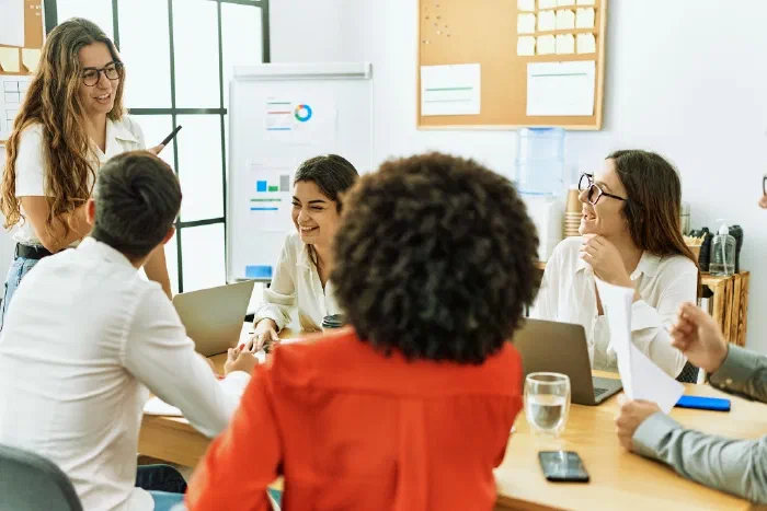 A team collaborating around a table on business planning A team collaborating around a table on business planning