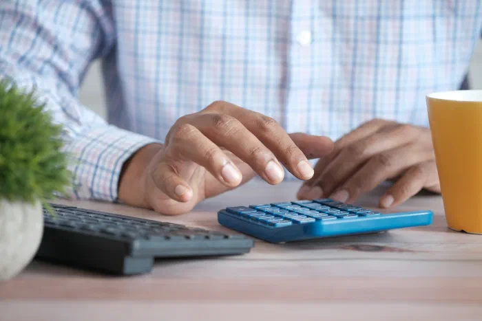 A business owner and bookkeeper reviewing financial records together